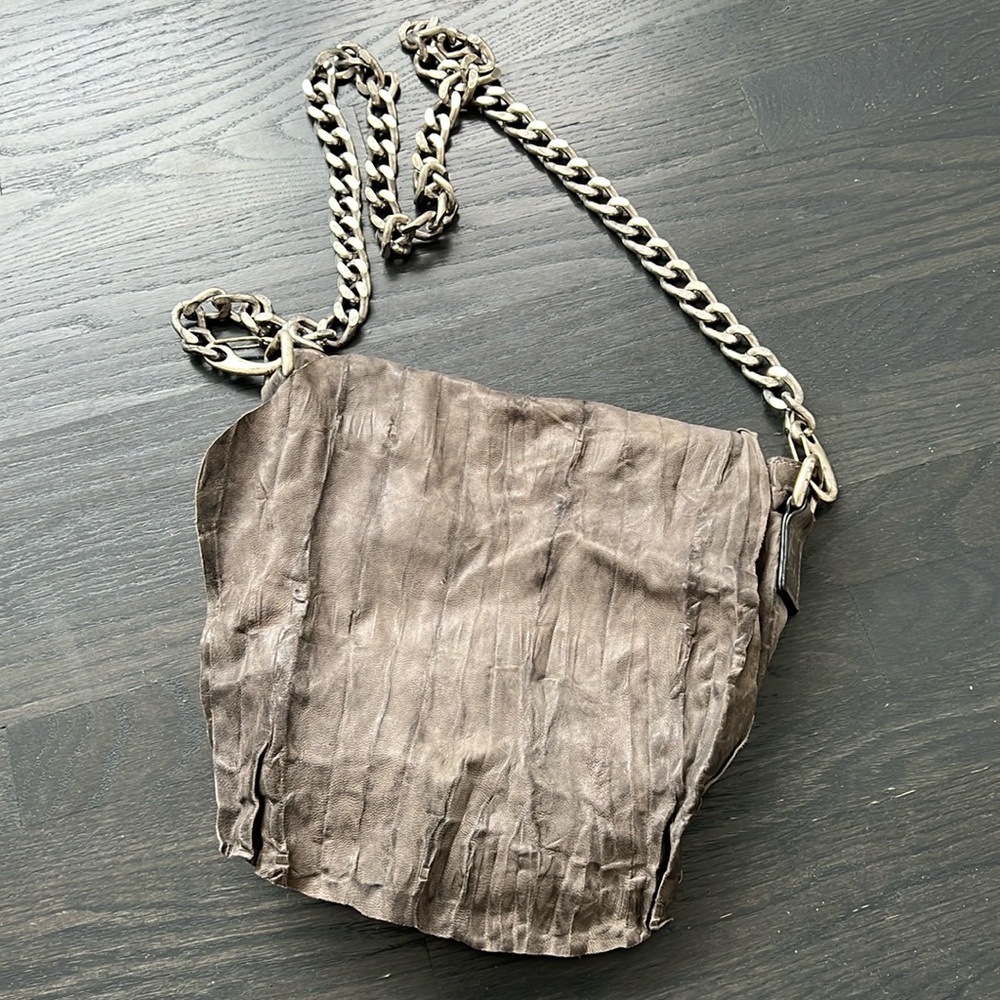 Cutuli crossbody distressed leather bag with heavy chain
